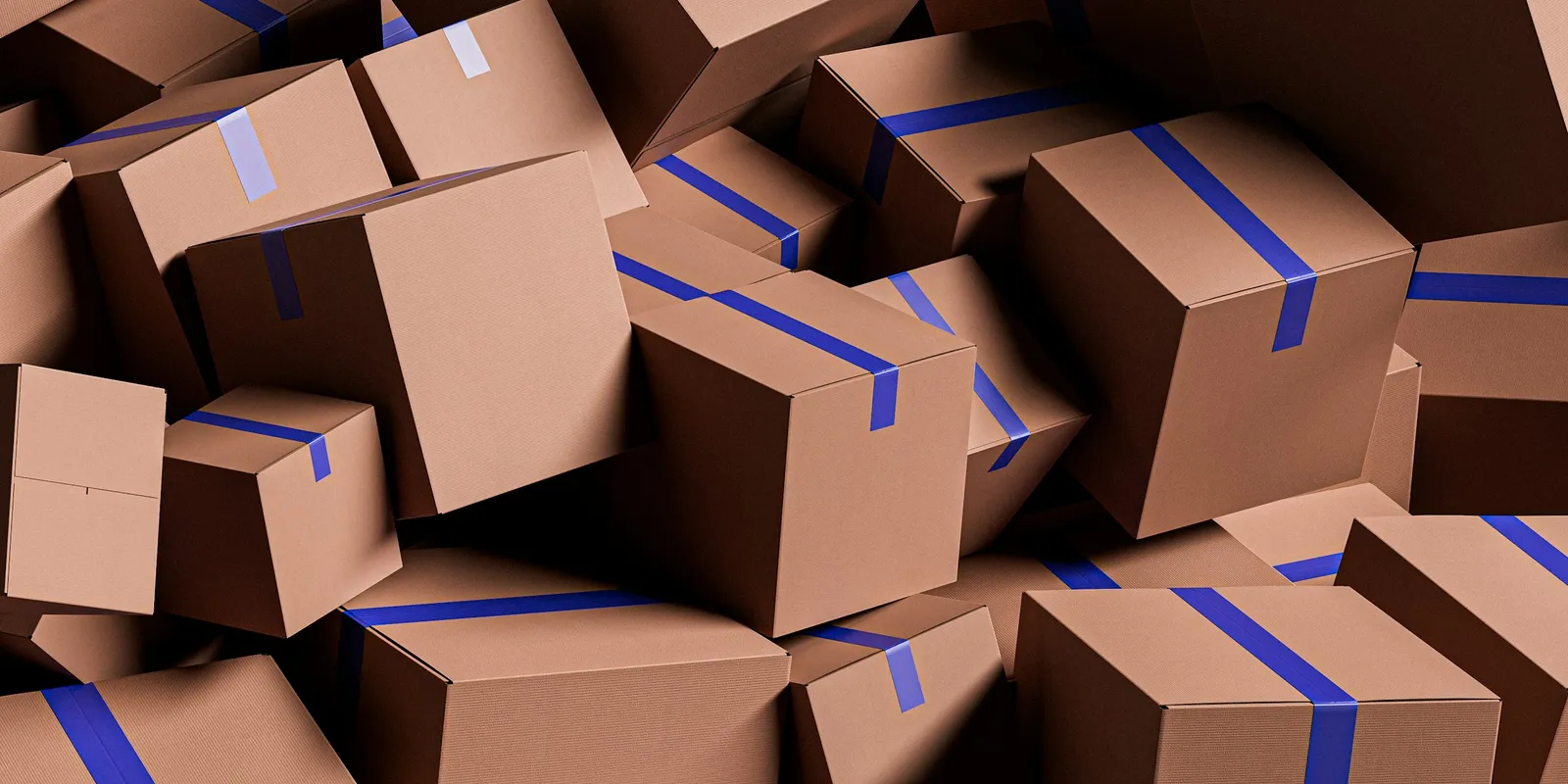 A pile of sealed cardboard parcels ready to ship to customers