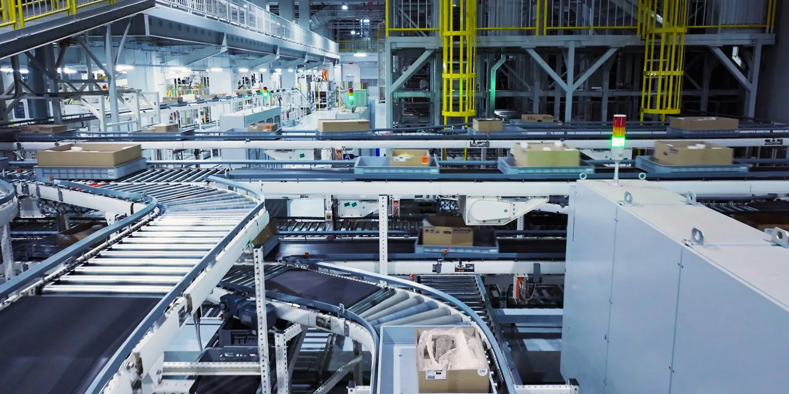 Parcels moving along a conveyor in a busy fulfilment centre